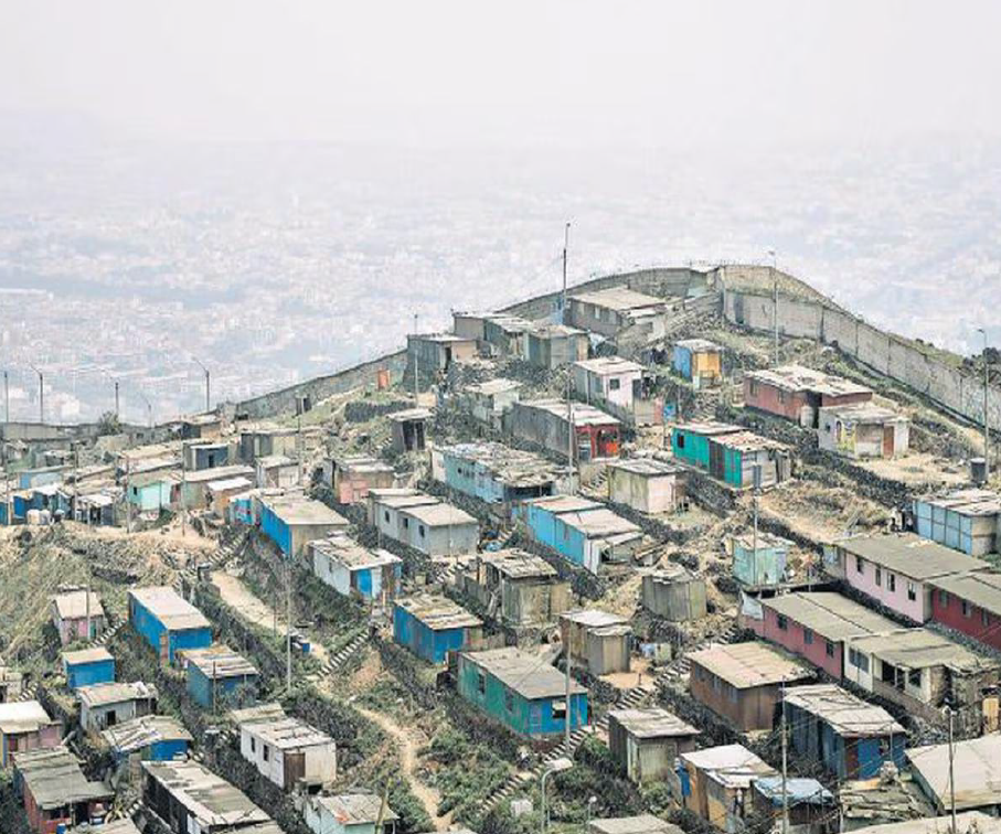 A hill in a city crowded with small, flat-roofed, one-family, living structures. 